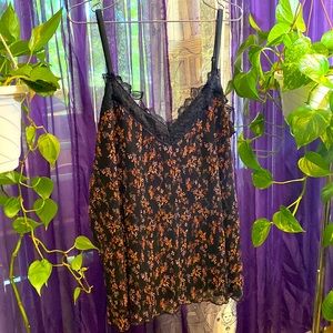 Feminine camisole with black lace trim.  Size 2X